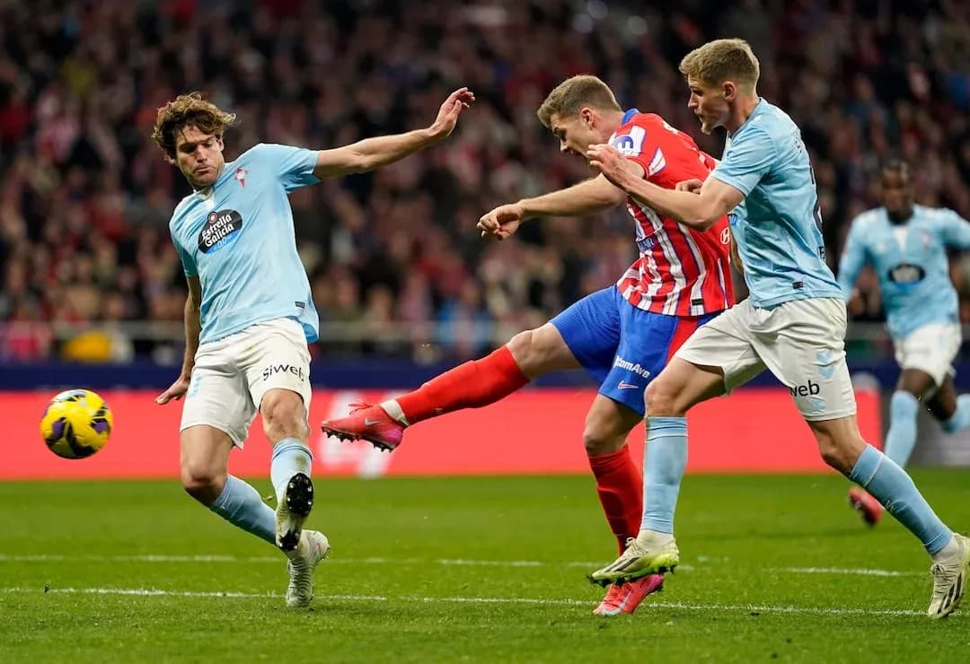 Atletico Madrid player shoots during match against Celta Vigo