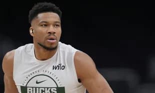 Player in Milwaukee Bucks shirt during warm-up