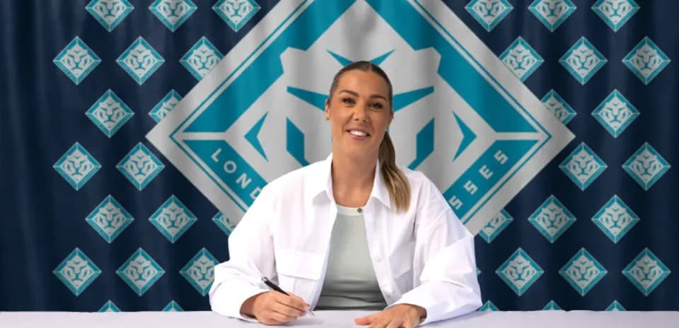 Player signing contract at promotional event