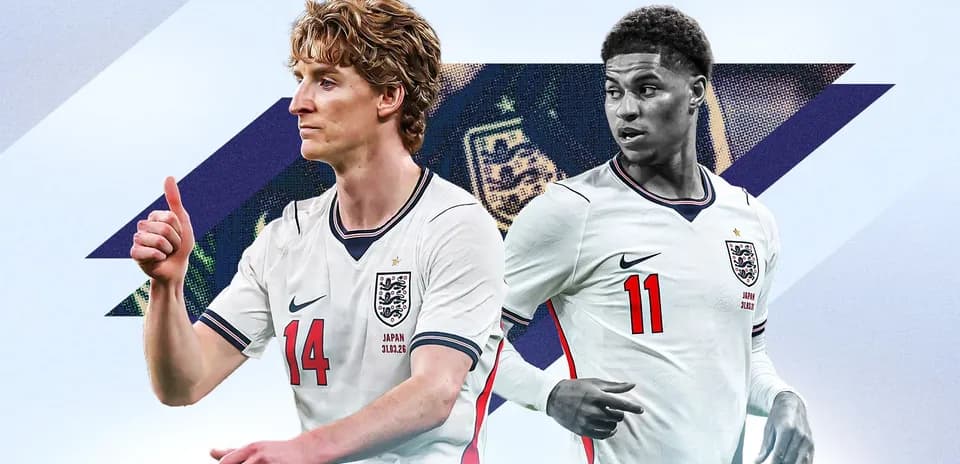 Two England players in jerseys, one giving thumbs up