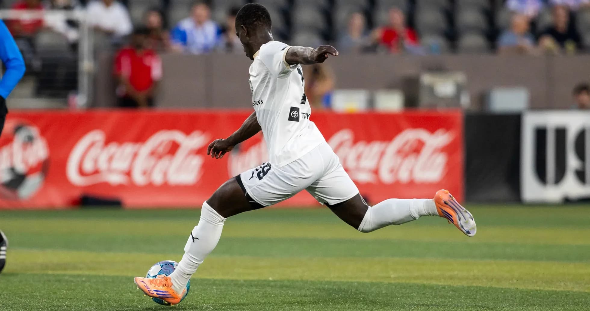Player running with ball during USL match
