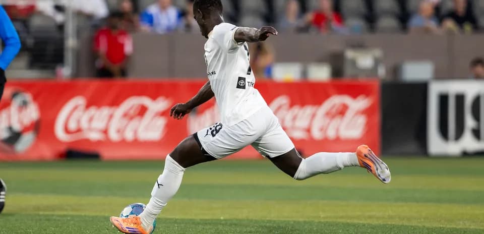 Player running with ball during USL match