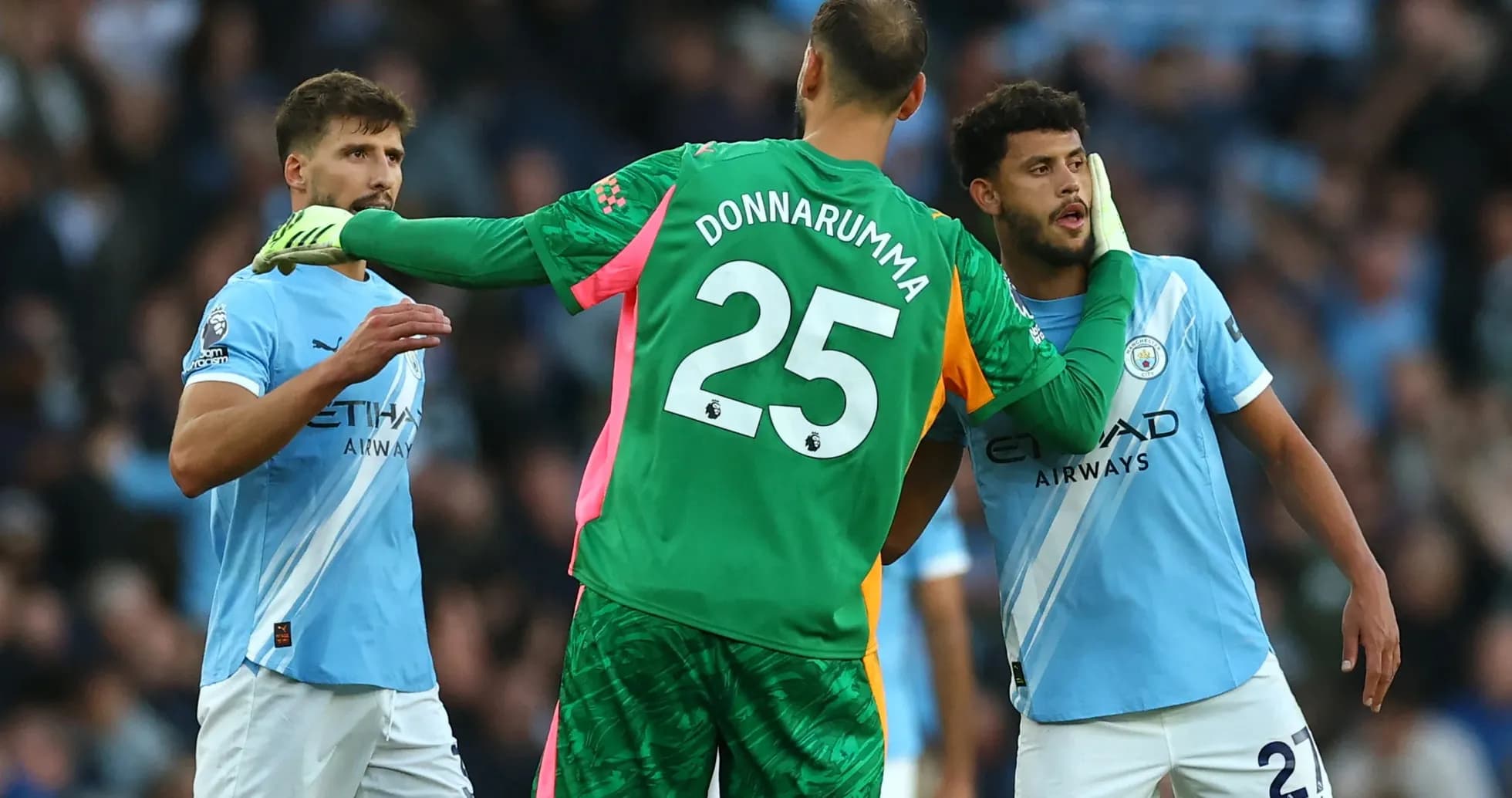 Manchester City players discussing during match