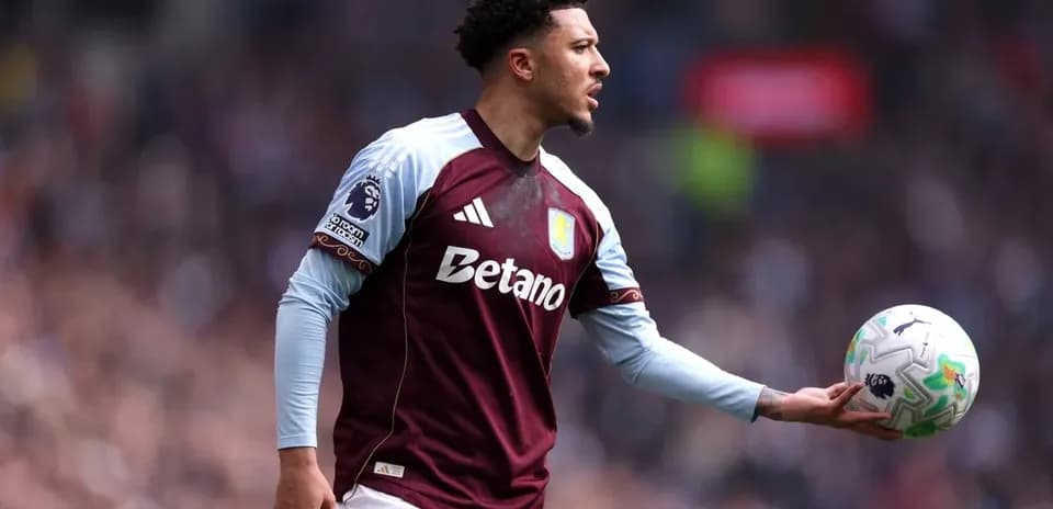 Player holding ball during match for Aston Villa