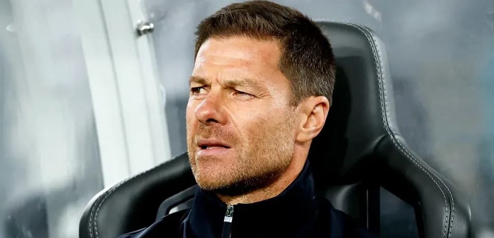 Coach sitting on bench during match
