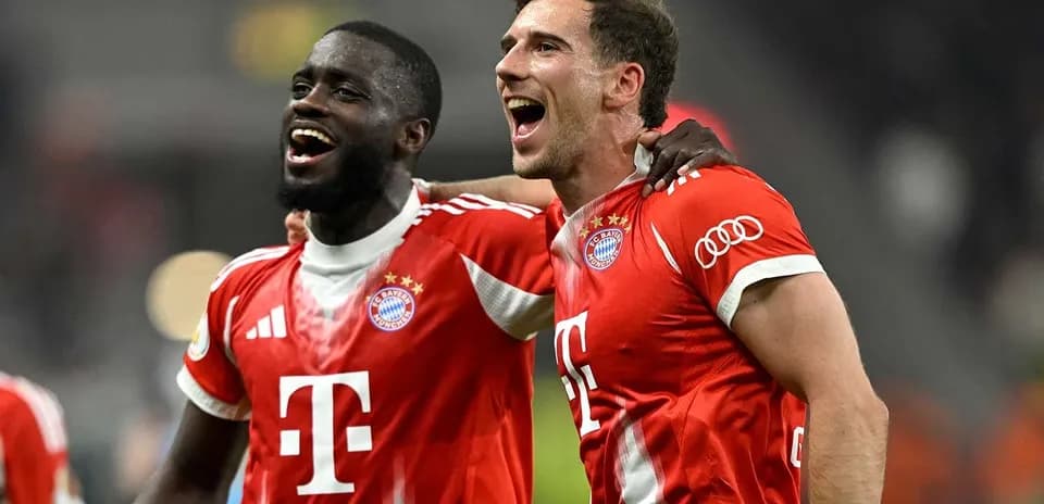 Two Bayern Munich players celebrating after a match