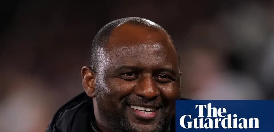 Coach smiling during a football match