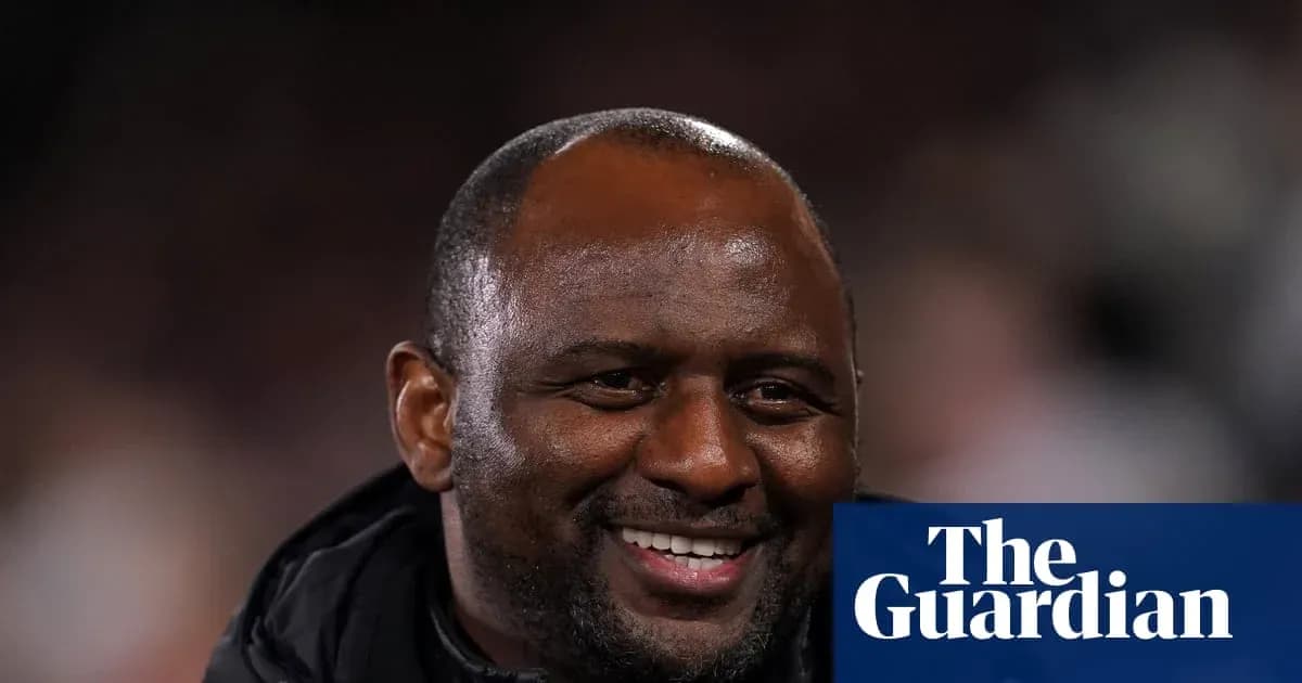 Coach smiling during a football match