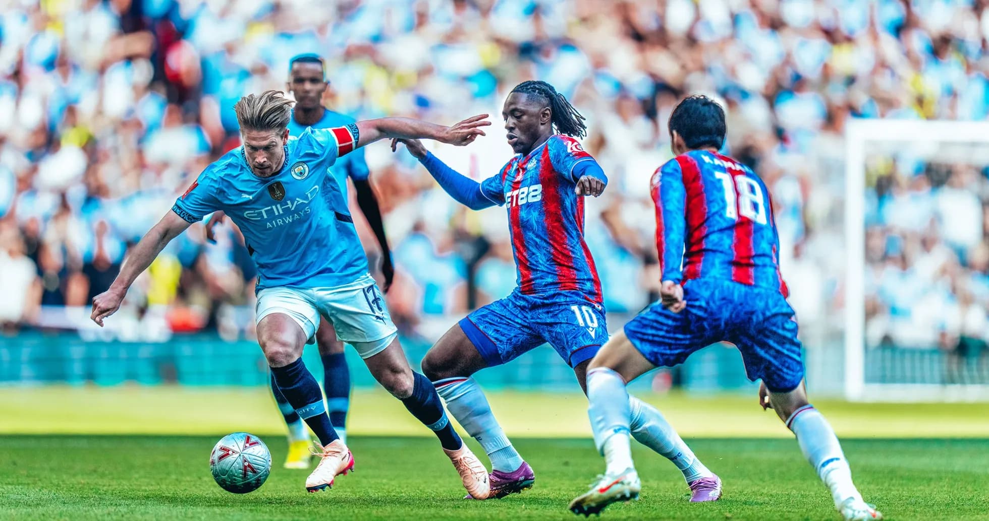 Manchester City players contesting the ball against Crystal Palace
