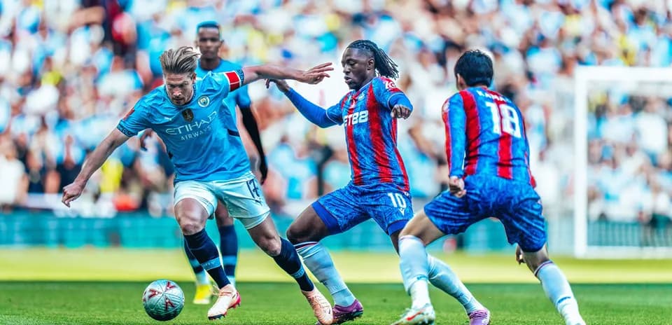 Manchester City players contesting the ball against Crystal Palace