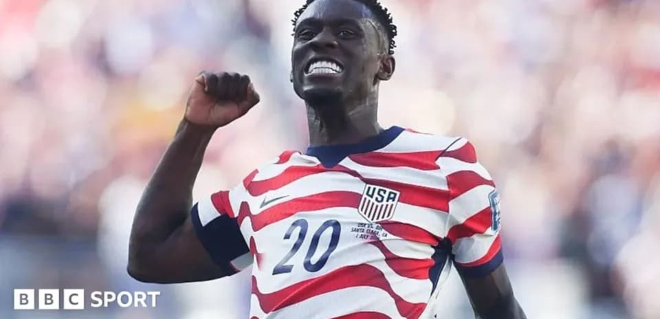 Player celebrating with fist pump in USA jersey