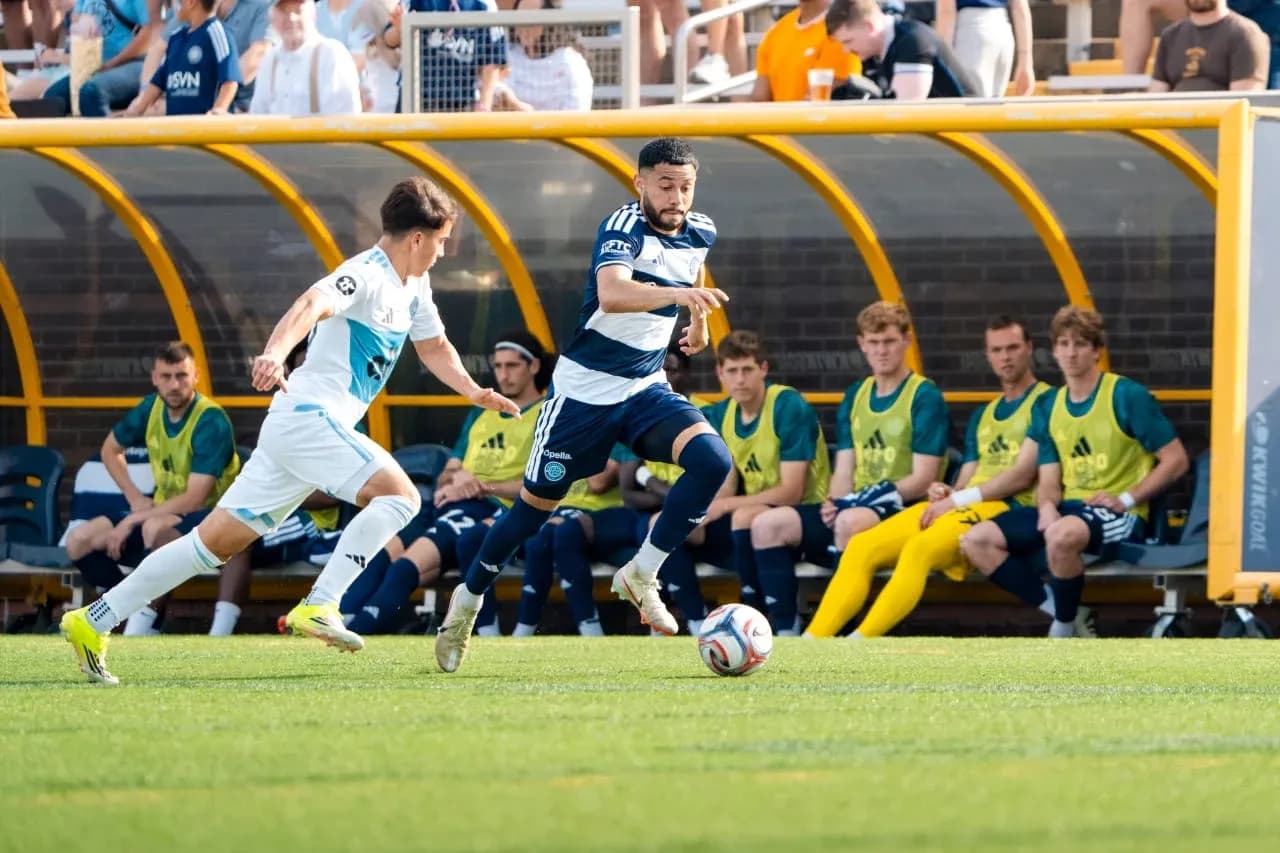 Crown Legacy player dribbling past Chattanooga opponent