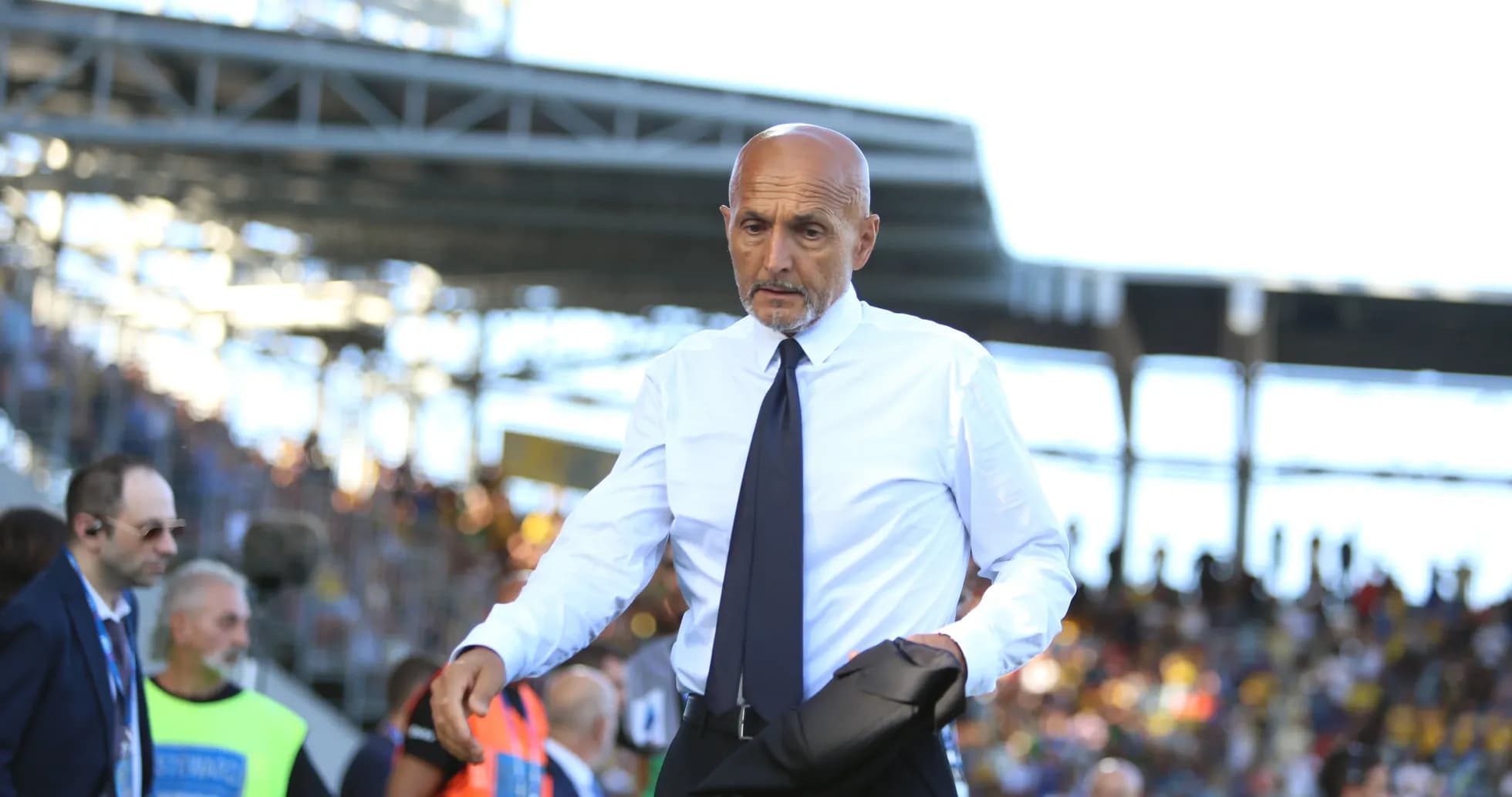 Coach walking on the sideline during match