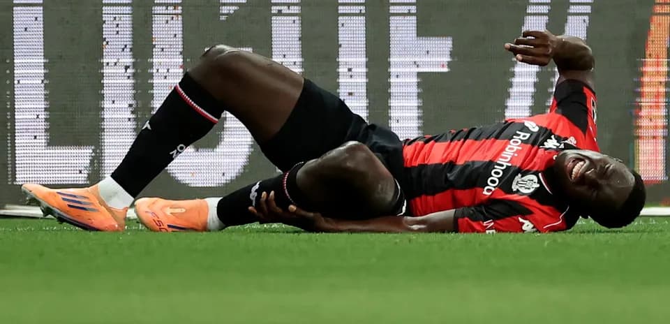 Player lying on ground in pain during match
