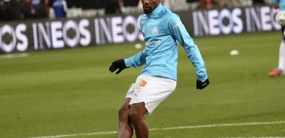 Player warming up on the field before match