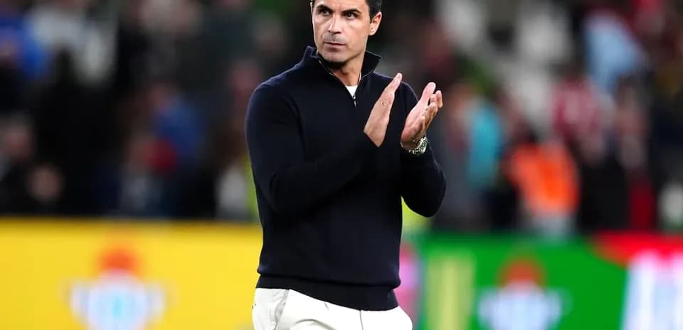 Coach applauding during a match on the sidelines