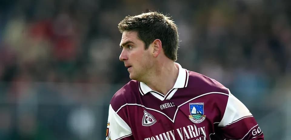 Player in maroon jersey during match action