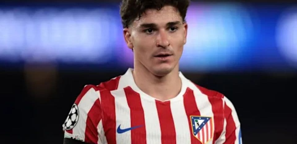Atletico Madrid player wearing red and white jersey
