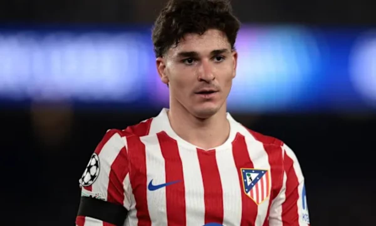 Atletico Madrid player wearing red and white jersey