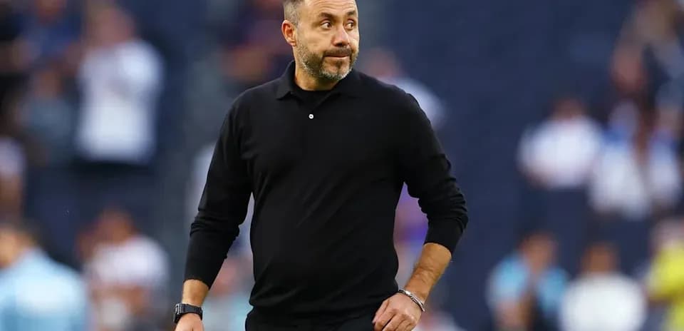 Coach walking on the sideline during a match