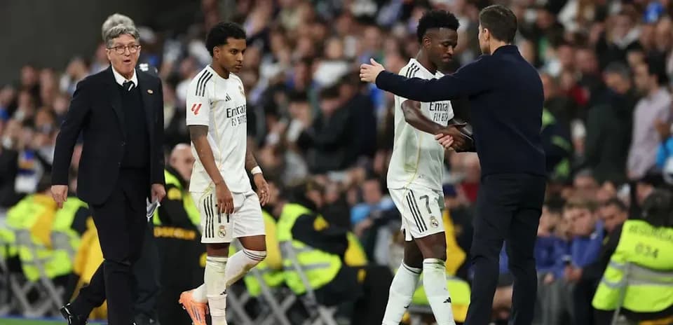Real Madrid players substituting during a match