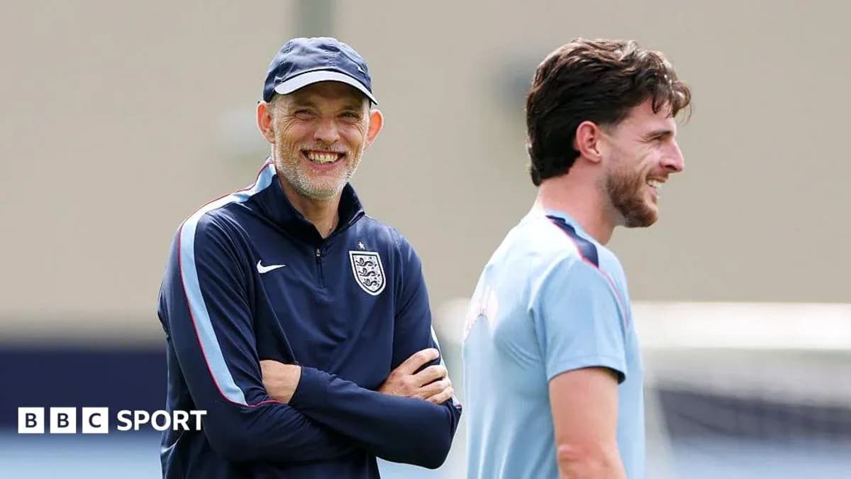 Coach and player smiling during training session