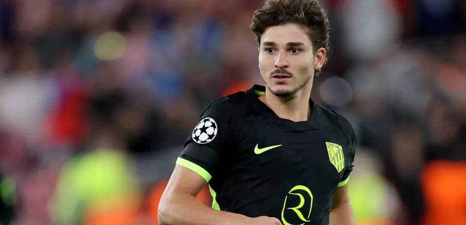 Player in black kit during a football match
