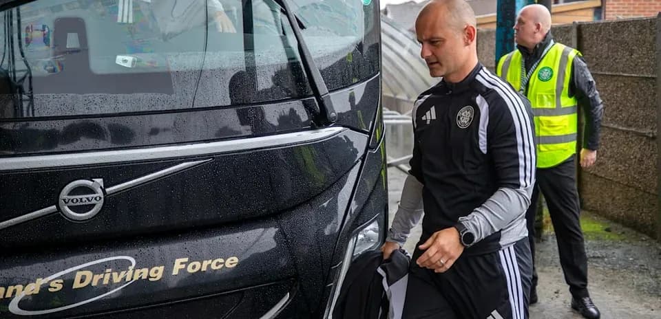 Coach arriving at venue with team staff