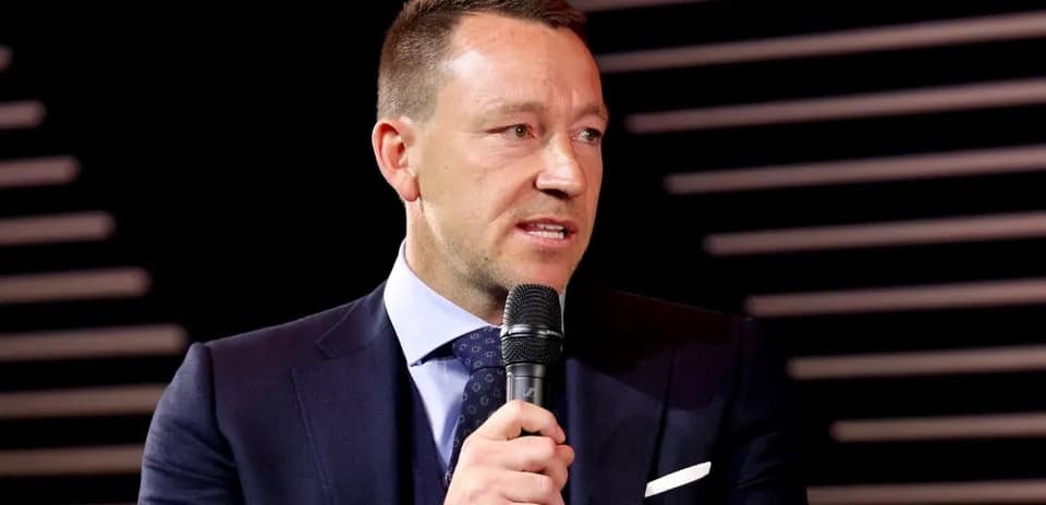 Man speaking into a microphone at event