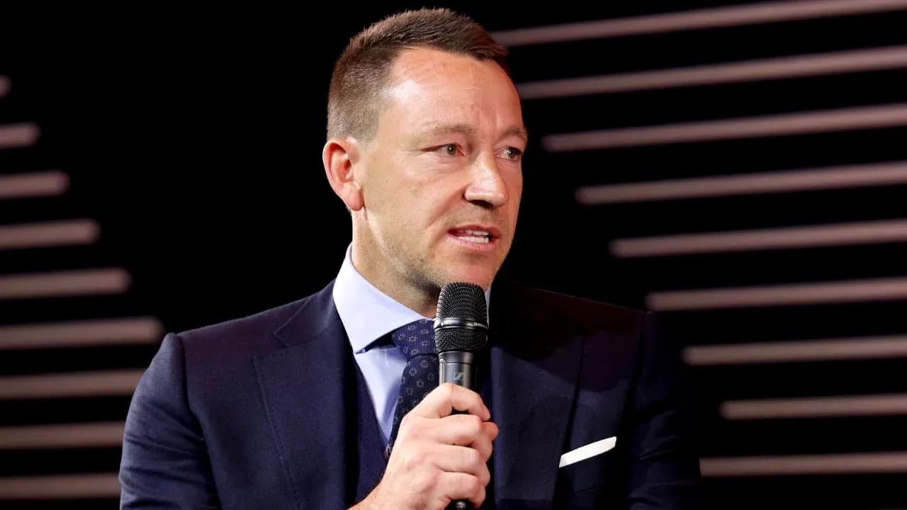 Man speaking into a microphone at event