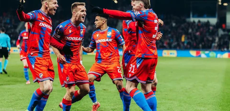 Players celebrating a goal during UEFA match