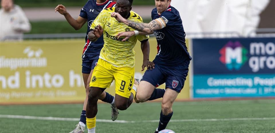 Pittsburgh Riverhounds player challenged by Indy Eleven