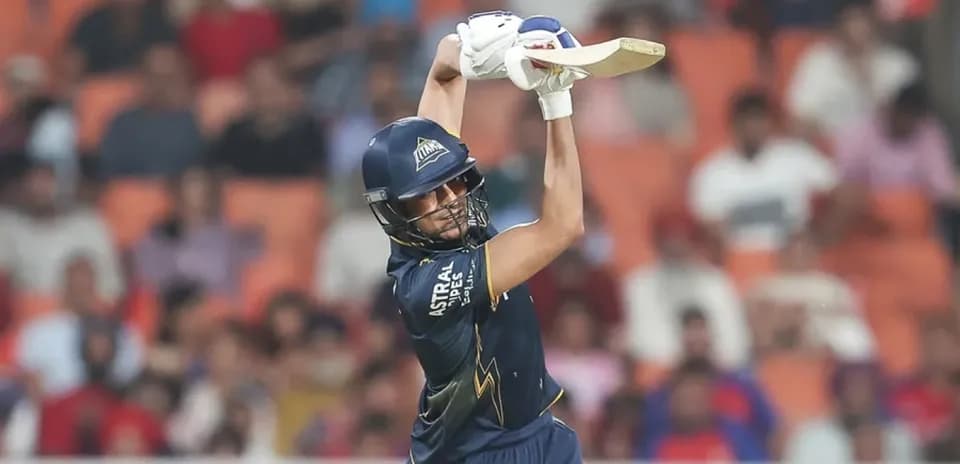 Batter hitting a shot during a cricket match
