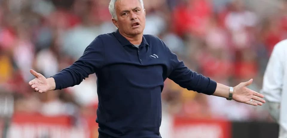 Coach gesturing during a match on the sidelines