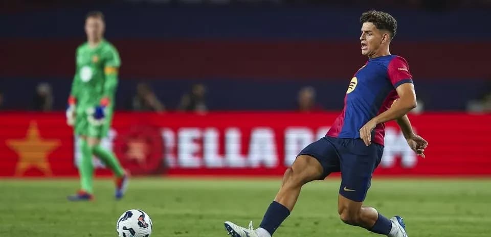 Player kicking ball during football match action