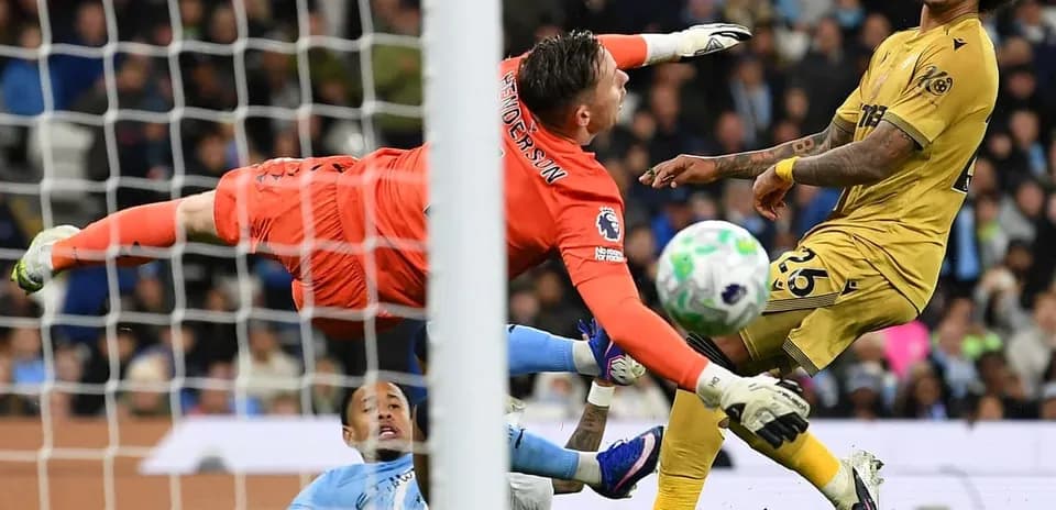 Goalkeeper diving to save during Crystal Palace match