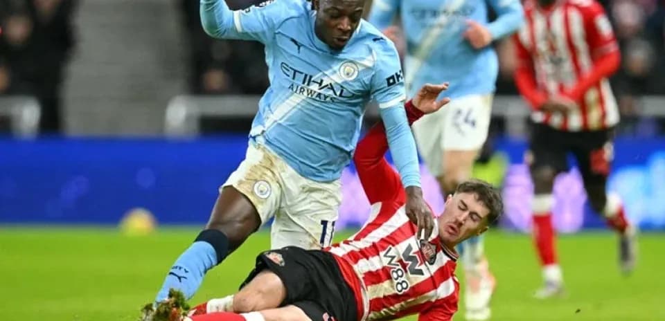 Player tackling opponent during a football match