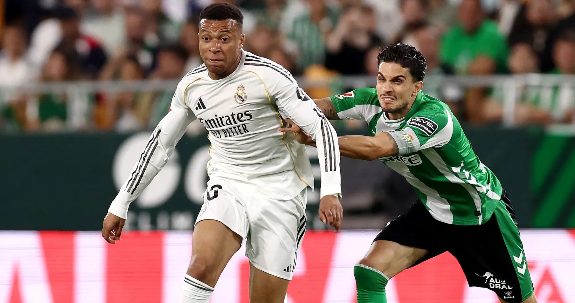 Player from Real Madrid evading a tackle during match