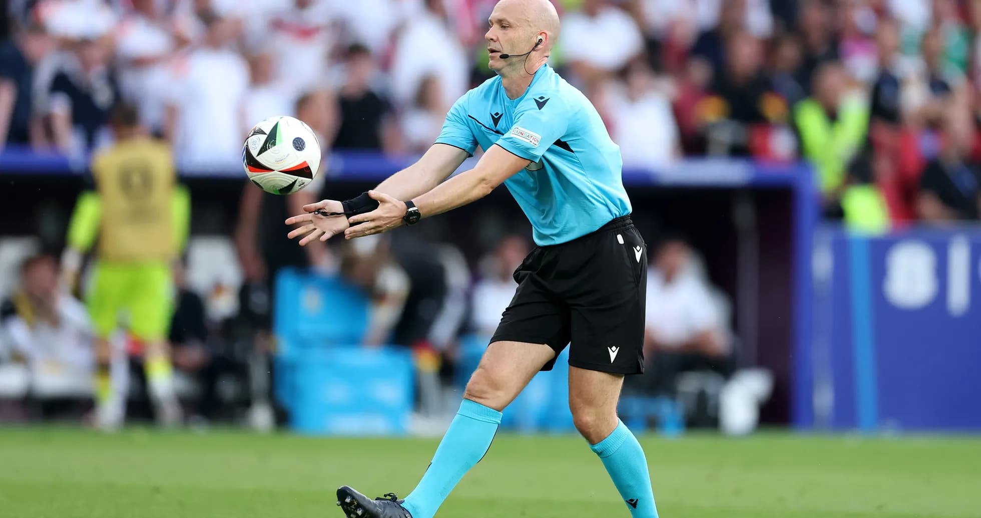 Referee preparing to throw the ball during match