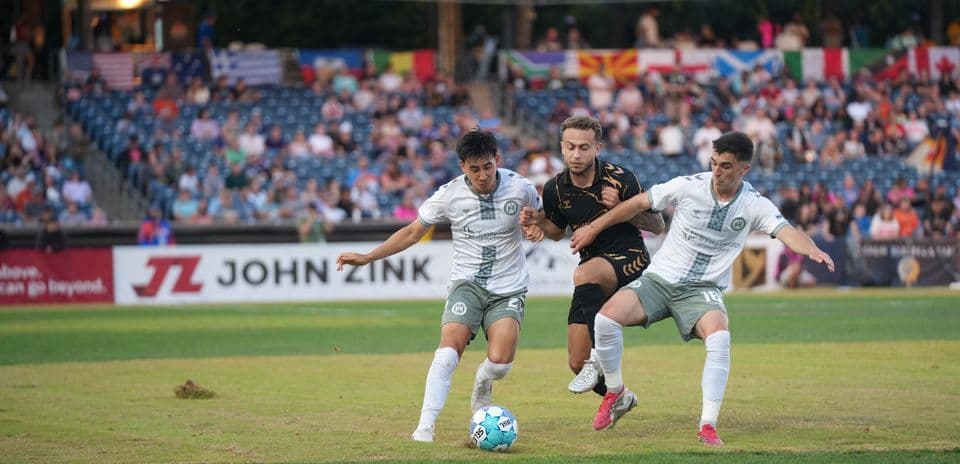 Players competing for the ball during match