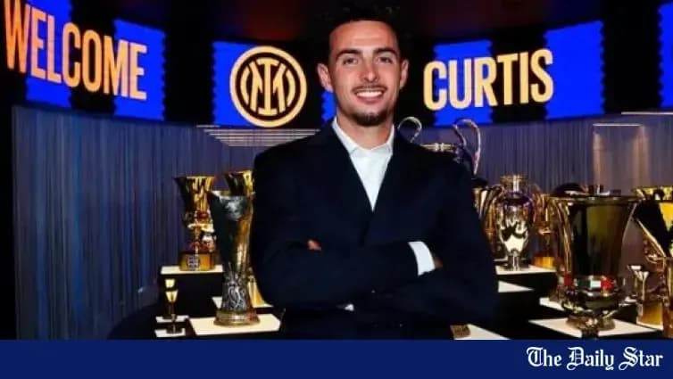 Player posing with trophies at welcome event