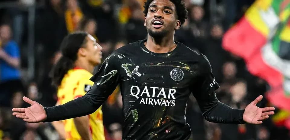 Player celebrating a goal in PSG black kit