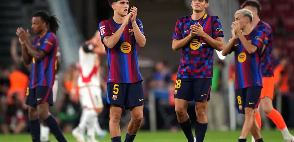 Barcelona players applauding fans after match