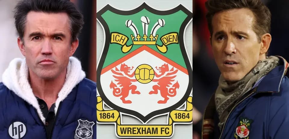 Two men beside Wrexham FC club logo