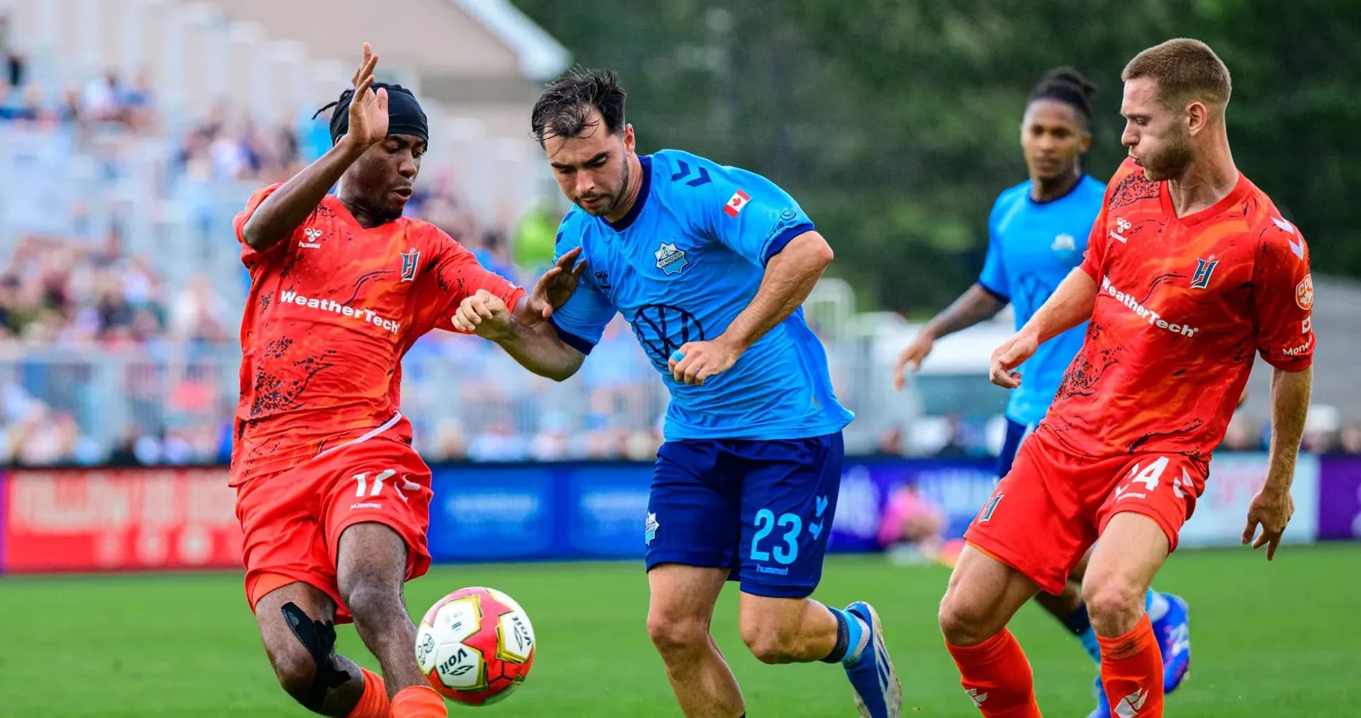 Players competing for the ball during match