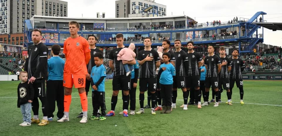 Players and kids during national anthem ceremony