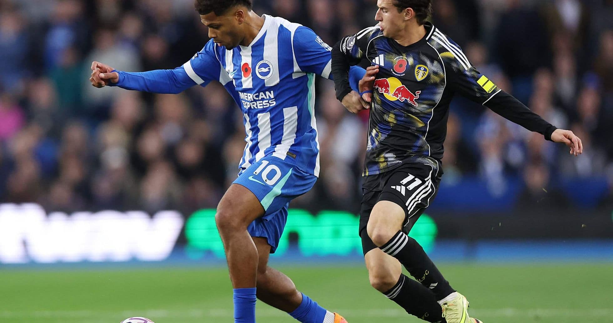 Brighton player dribbling against Leeds defender