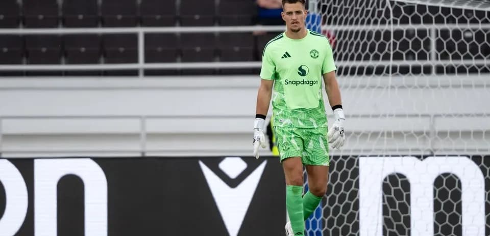 Goalkeeper in green kit during match preparation