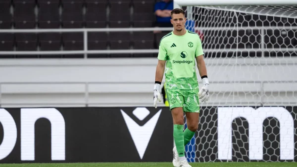 Goalkeeper in green kit during match preparation