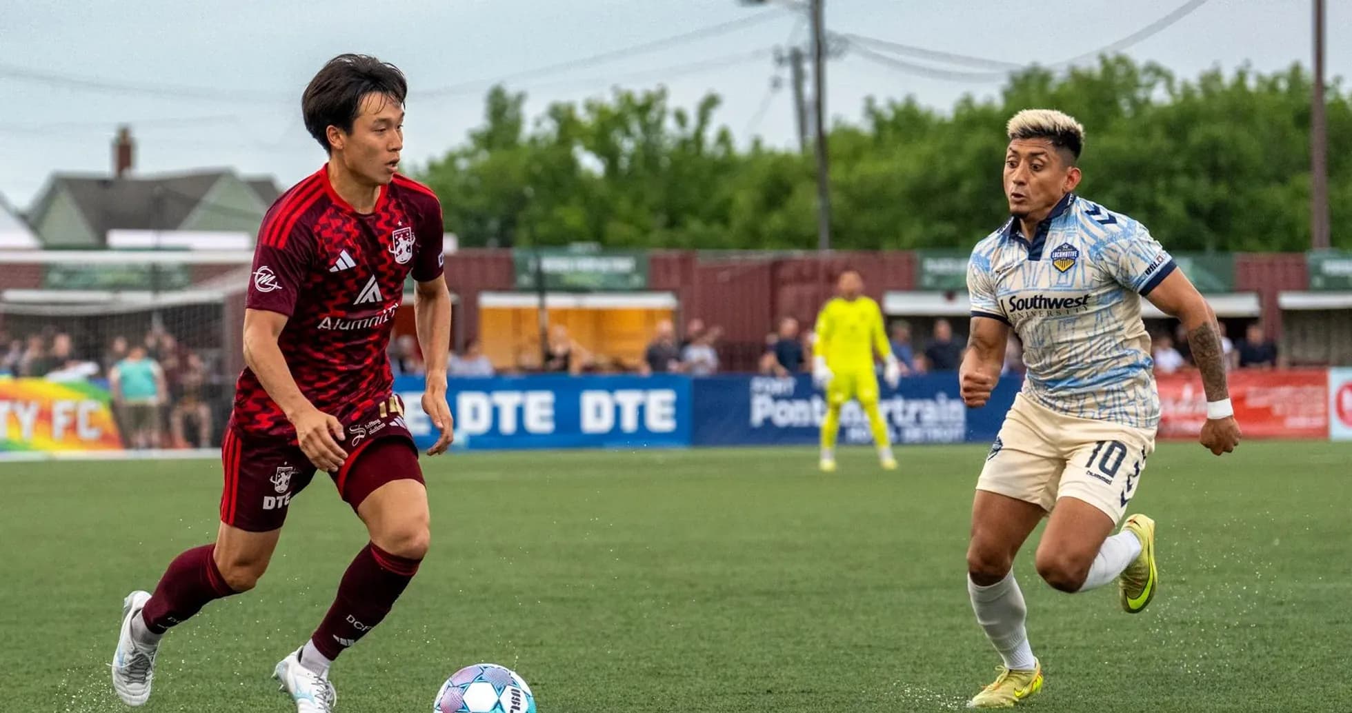 Players competing for the ball in USL match